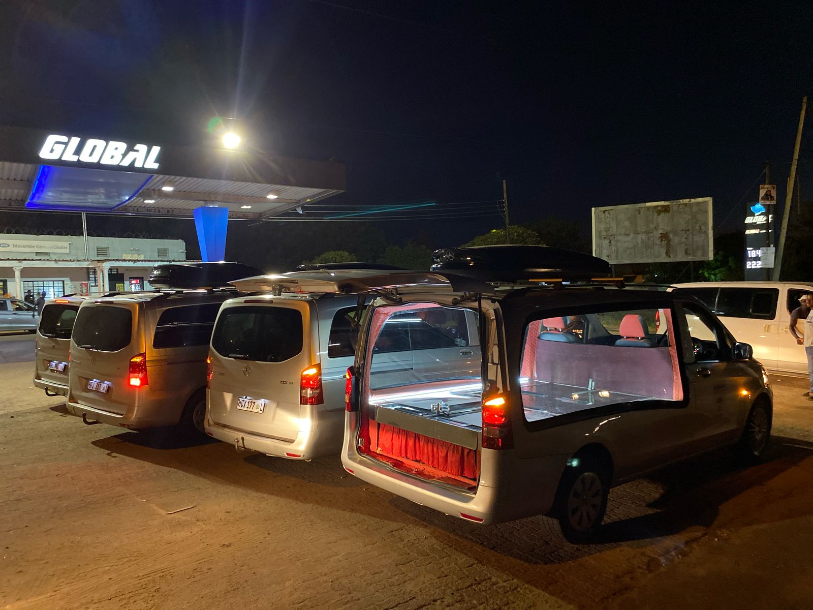 Funeral fleet lined up at night